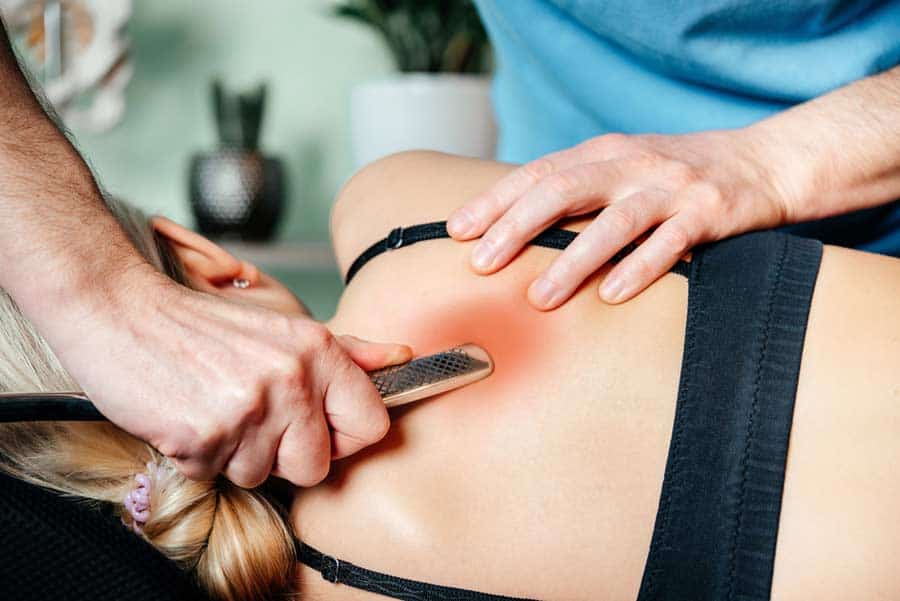 Triggerpunktmassage mit Massagegerät (depositphotos.com)